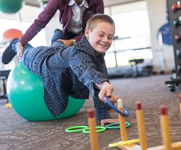 Occupational-therapy-assistant-working-with-young-child